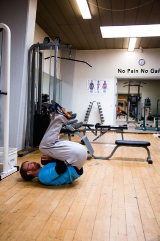 Squat, rolling to standing